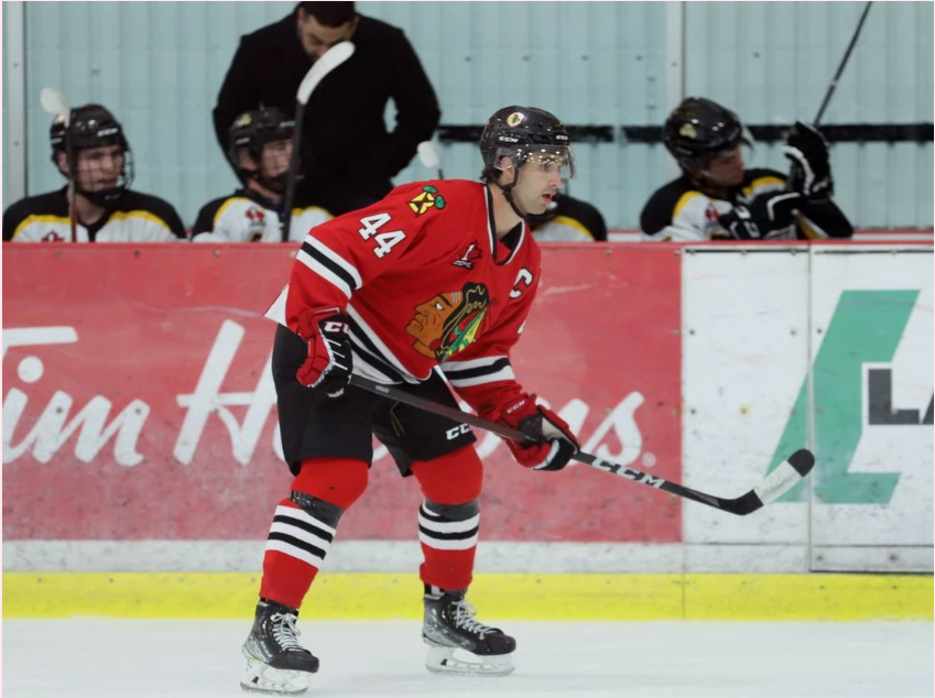 Captain Thomas Haynes of the Brockville Braves stands in front of the Smiths Falls bench during their CCHL pre-season game at the Brockville Memorial Centre last Friday. The Braves and Bears will face off again in Brockville to open the regular season this Friday night. Tim Ruhnke/The Recorder and Times