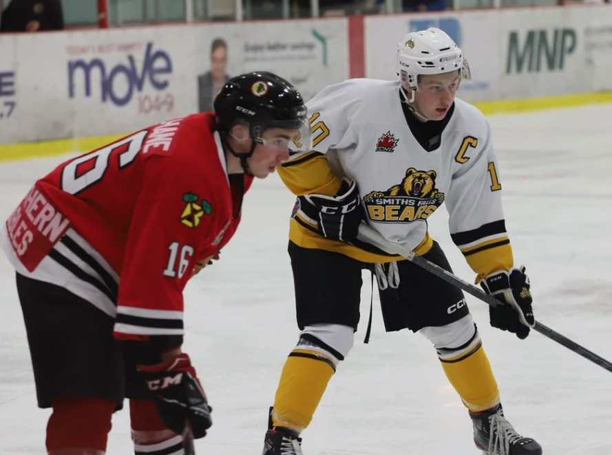 Lucas Culhane and Sean James await a faceoff during the Braves-Bears game in Brockville on Friday, Dec. 16.